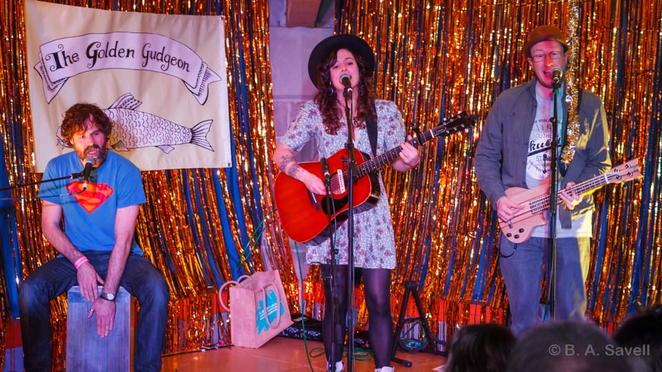 BarrySavell's tweet photo. @BradfordRoots 
Tamsin Quin on the Golden Gudgeon stage at Bradford Roots Music Festival 2020, with accompaniment from Phil Cooper and Jamie R Hawkins. These three have now formed a group - The Lost Trades.
#MyBradfordRoots https://t.co/jRzS2BUrhO