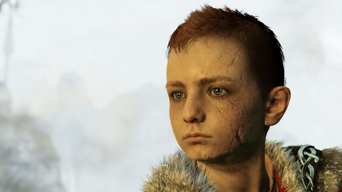 The scars on the right side of Atreus' face are shaped like the Kratos...