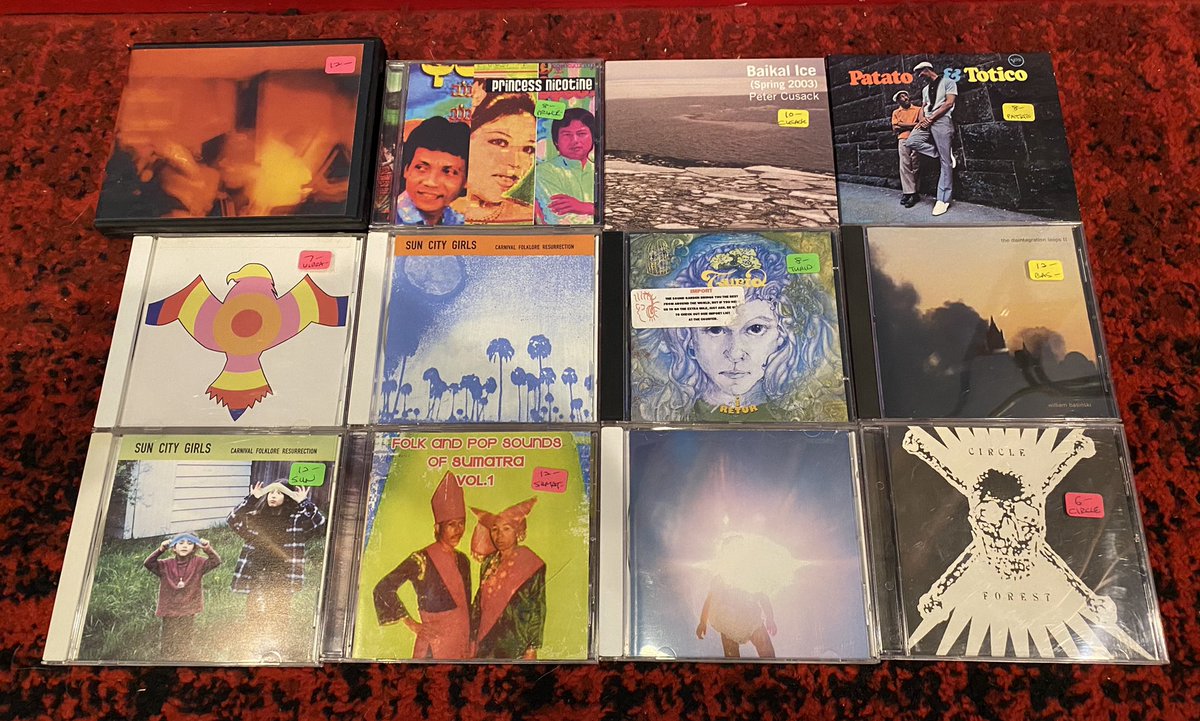 NormalsBooks's tweet photo. Box of CDs in that are deep & essential. Would break your wallet and/or mind to find them on vinyl. #SunCityGirls #Boredoms #vibracathedralorchestra #PopSoundsOfSumatra #WilliamBasinski #PatatoTotico #Circle #Turid #PeterCusack #PrincessNicotine https://t.co/JrDO1WwtEJ