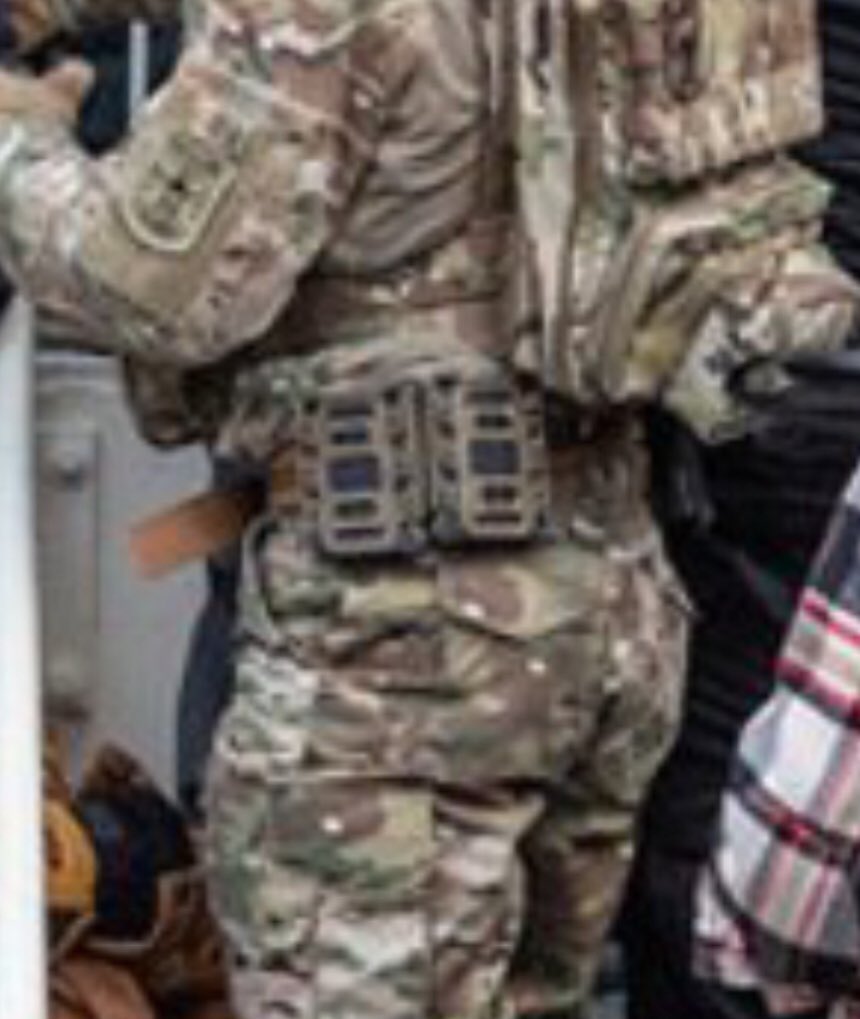Here’s an up close of Magnolia’s kit. I have been told his “uniform” & set up are not cheap & perhaps a knock off SOF. Can we ID it?Can anyone make out the backpack manufacturer or symbols on there?