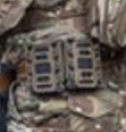 Here’s an up close of Magnolia’s kit. I have been told his “uniform” & set up are not cheap & perhaps a knock off SOF. Can we ID it?Can anyone make out the backpack manufacturer or symbols on there?