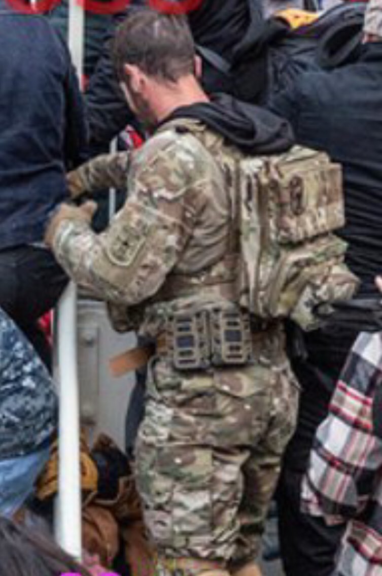 Magnolia is holding a flag pole or some other type of pole, but later when he is at the side of the archway, he no longer has it.