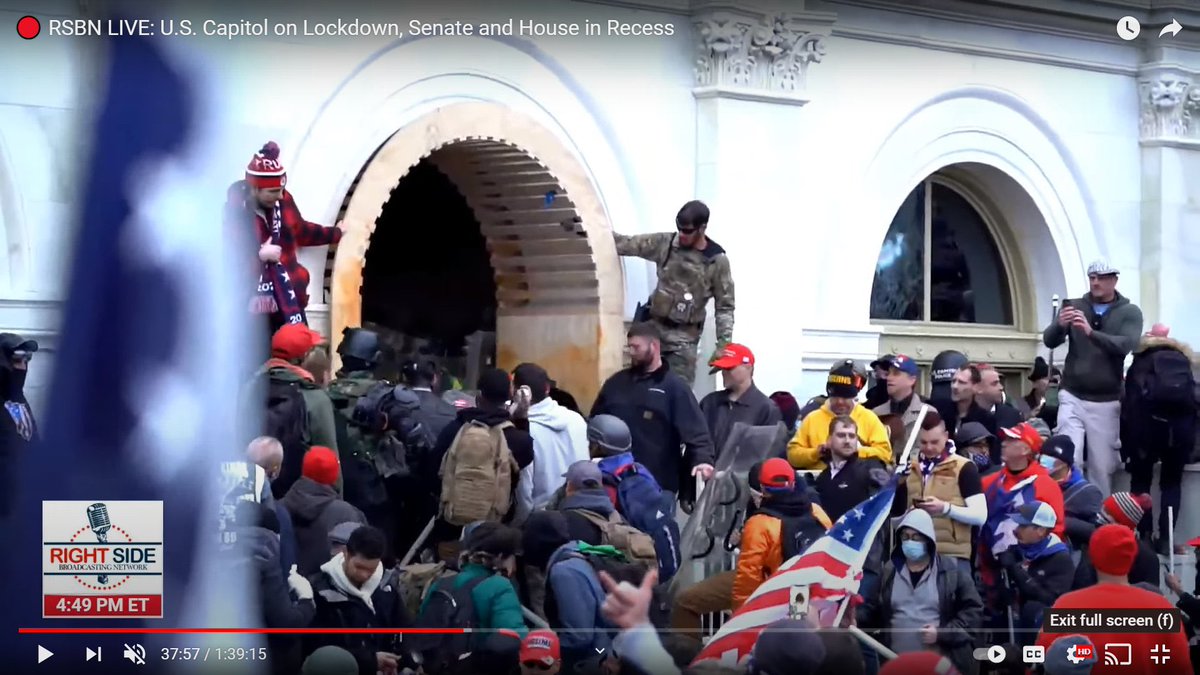 Magnolia is holding a flag pole or some other type of pole, but later when he is at the side of the archway, he no longer has it.