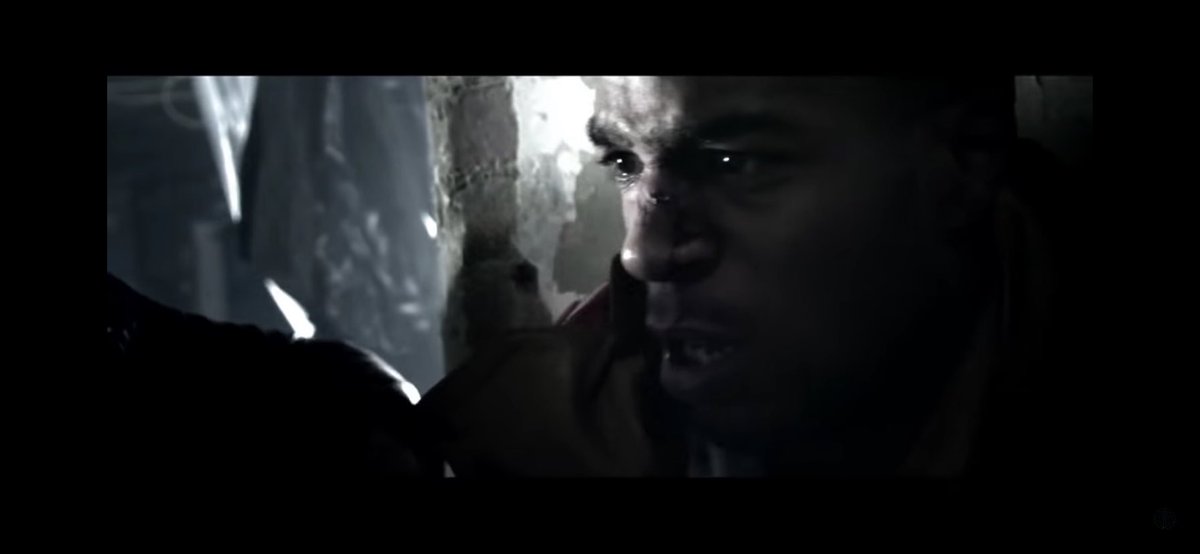 After missing the punch, Cudi loses balance & is then attacked by the demons before being pushed back against a wall & thrown through wooden planks.