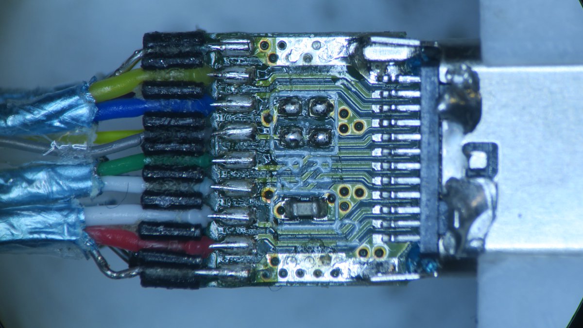 The wires are held in place by a piece of plastic that makes sure they are aligned so they can be soldered directly to the PCB. Also note that only one pair of USB 2 data pins is actually present, as per spec, it's up to the Receptacle to connect them together.