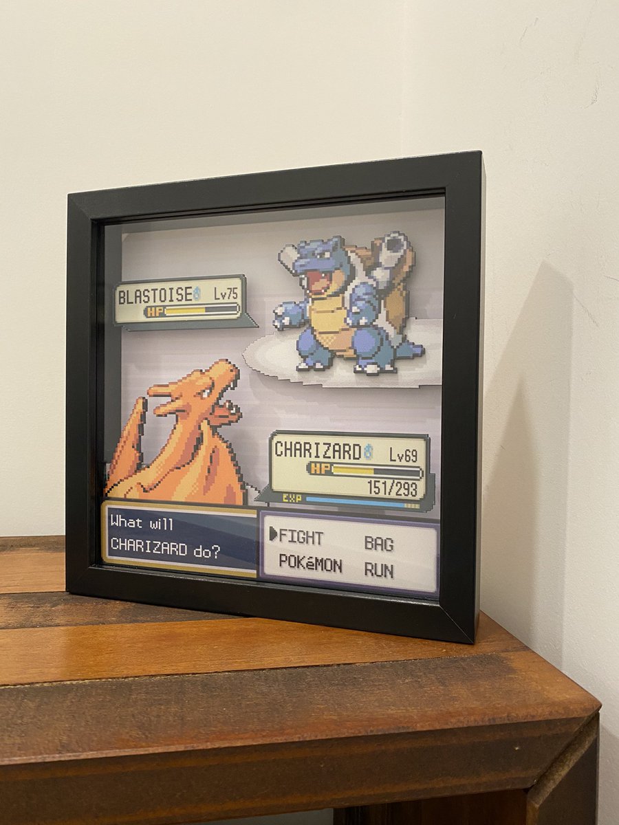 hero___n's tweet photo. My new shadow box made by @chimo55jimbo!!! Huge shoutout to him for taking my VERY specific request with care and attention to detail.

It depicts the final battle between you and your rival in Fire Red after defeating the Final Four 🙌

Blastioise💦🐢 VS. Charizard🔥🐉
#pokemon https://t.co/bFMYF6SVg8