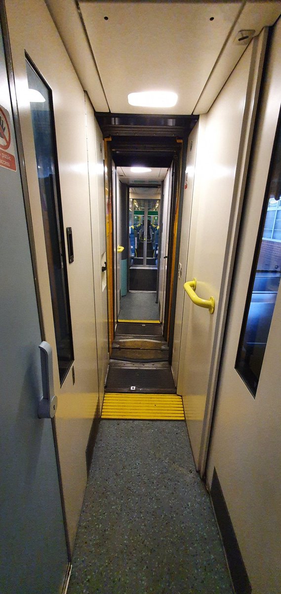  We repeat this on the rear portion, but in the reverse order. Fly door, weather door, then swinging door. Now we can see right through from one unit into the other. When the swinging door is in the corridor position, the corridor light comes on automatically.