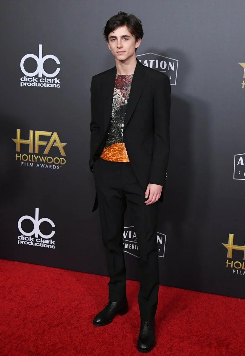 13 October 2018At the London premiere of Beautiful Boy, Timothée arrived wearing a floral suit by  @McQueen .4 November 2018Timothée chose a black suit worn with an embellished top by Louis Vuitton for the Hollywood Film Awards.