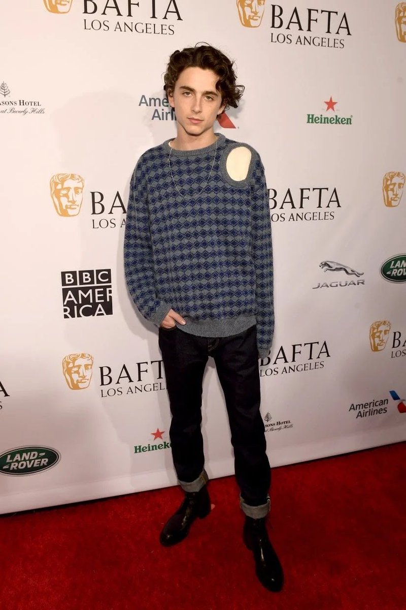 5 January 2019He attended a Bafta tea party in Los Angeles wearing a Raf Simons knit with indigo turn-up jeans.6 January 2019Timothée wore an embellished bib by Virgil Abloh for Louis Vuitton at the 2019 Golden Globes.