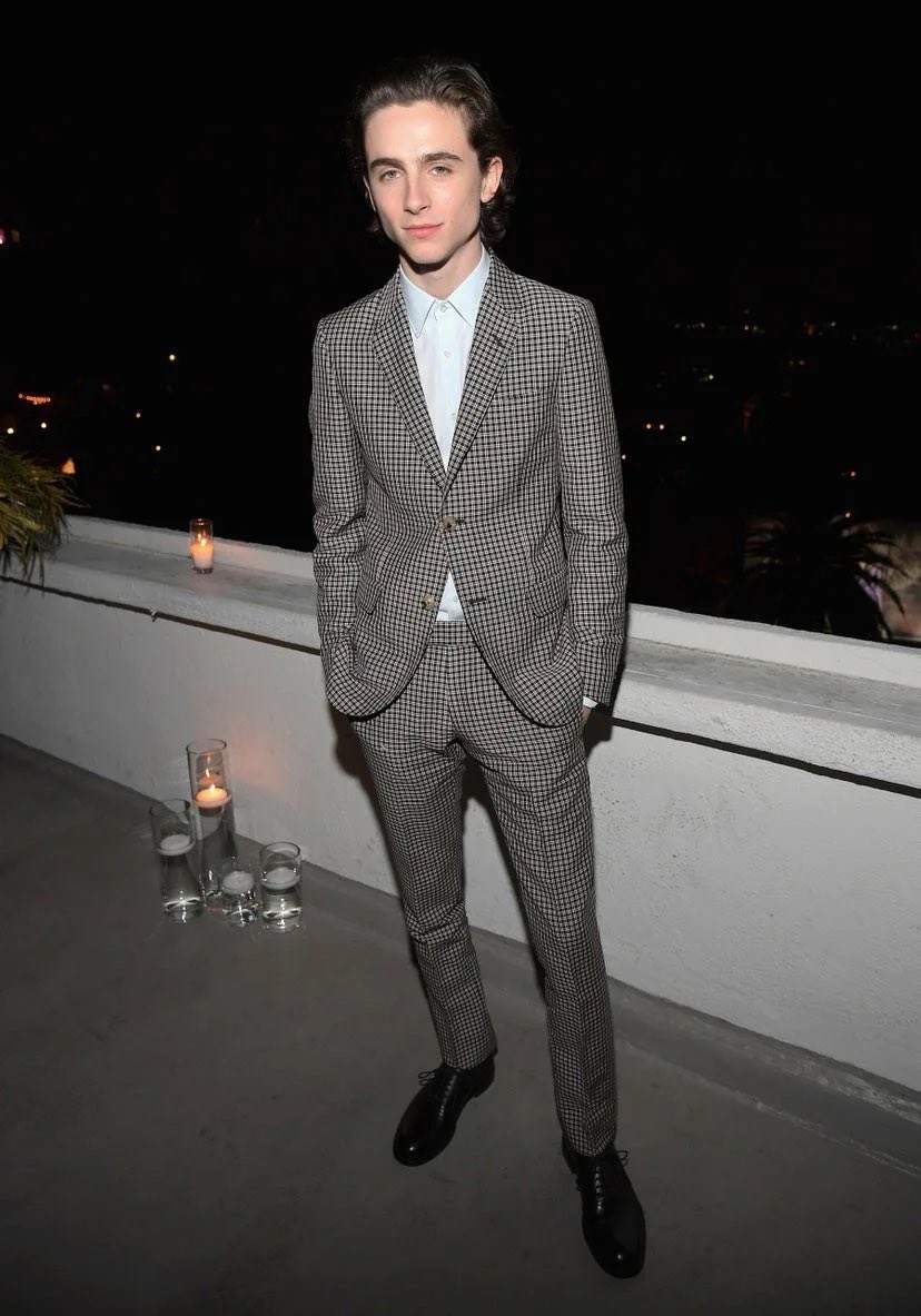 27 November 2017He wore green trainers with a jumper and shirt pairing to visit the SiriusXM studios in NYC.Timothée stepped out in a Gucci checked suit and baby blue shirt for a Dior Homme dinner at Chateau Marmont.