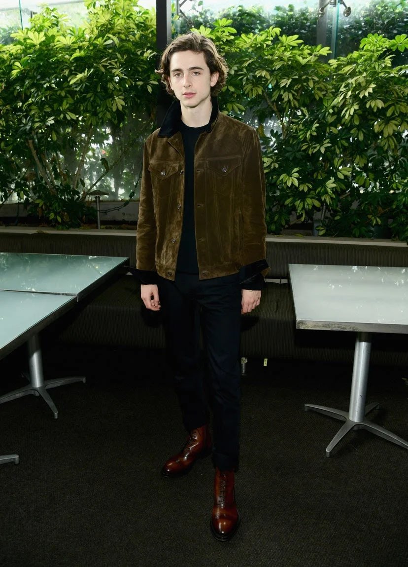 6 January 2018He once again wore cropped Berluti trousers with lace-up boots and a brown suede jacket for an event in West Hollywood. 7 January 2018For the 2018 Golden Globe Awards, Timothée chose a classic black tuxedo by Berluti.