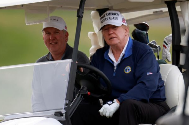 Donald Trump spends weekend playing golf and he's still wearing his MAGA hat