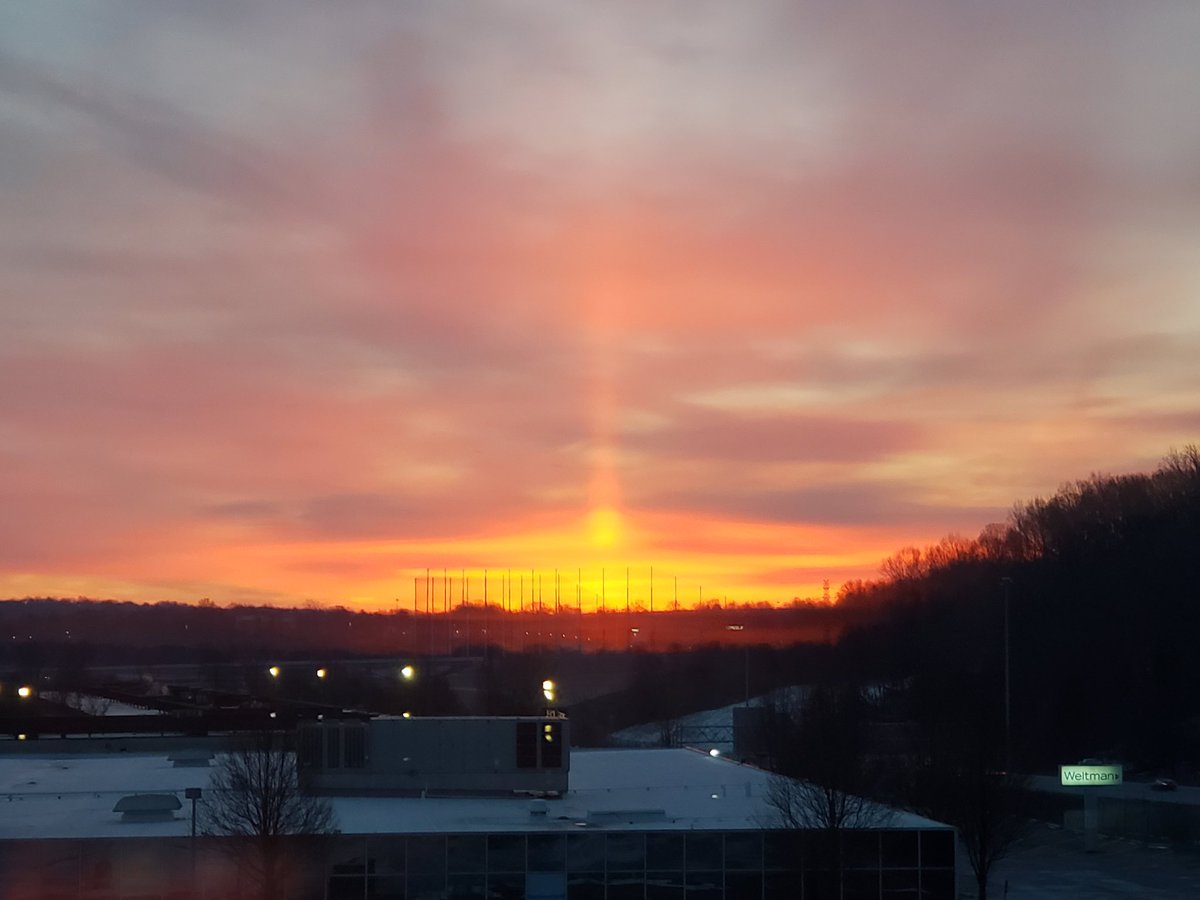 What a beautiful view.  A sun pillar formed at sunrise this morning.  They are formed at sunset or sunrise when ice crystals fall from the sky reflecting the sun's rays off them. #OHwx
