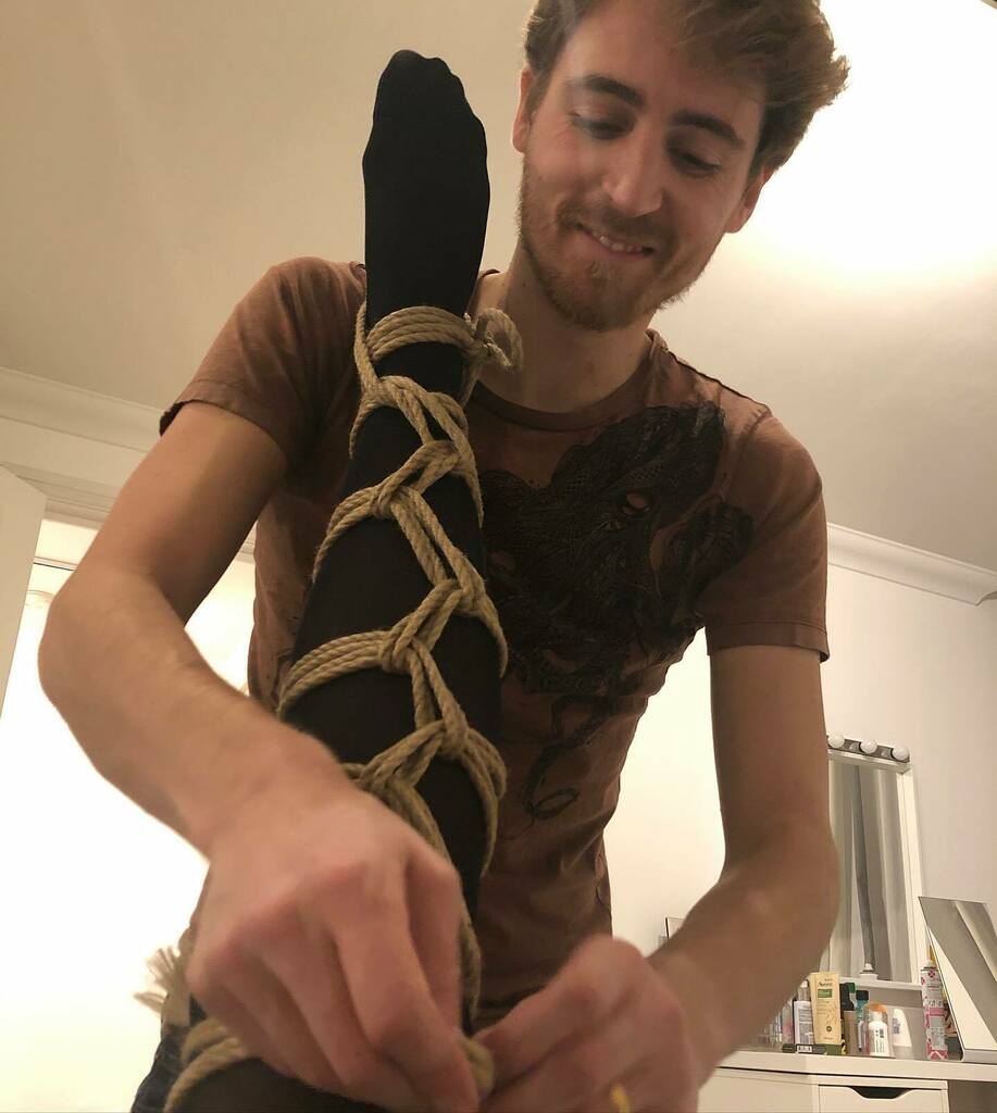 ropesquared's tweet photo. Came across this lovely action shot of @roryropes from back in October while looking for something else. Stockings and rope, no wonder he’s smiling! Looking forward to when we’re able to tie again together safely. 

Until then...please join us in the sel… https://t.co/RaJU4uLrIF https://t.co/U09Wr5tBG2