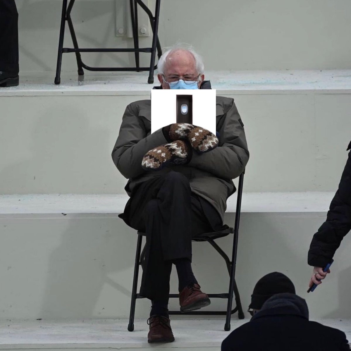 Bernie holding Swimming by Mac Miller