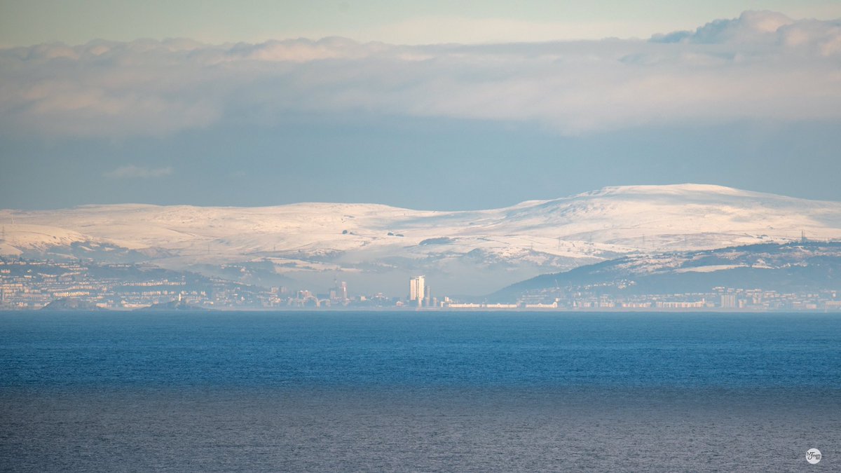The snow covered hills above #swansea #southwales this morning taken from #ilfracombe #northdevon over the Bristol Channel 👋❄️