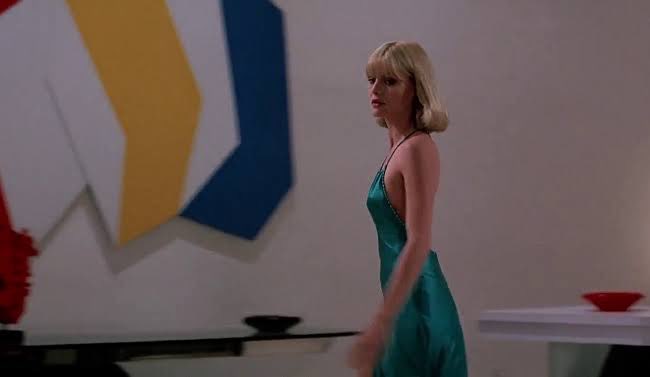 green emerald velvet dress Scarface Michelle Pfeiffer as Elvira Hancock Posing on Floor 8 x 10 Inch  Photo at Amazon's Entertainment Collectibles Store