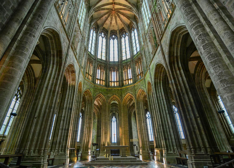 9/ Mont-Saint-Michel is one of the last places in France that kept its 13-14th century fortifications. When you enter inside the central church of the island, its Roman features gradually merge into a Gothic cathedral.