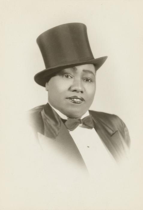 The favored ensemble of Gladys Bentley, a performer during the Harlem Renaissance - a white top hat & tuxedo. Sometimes she opted for black. She was openly lesbian.