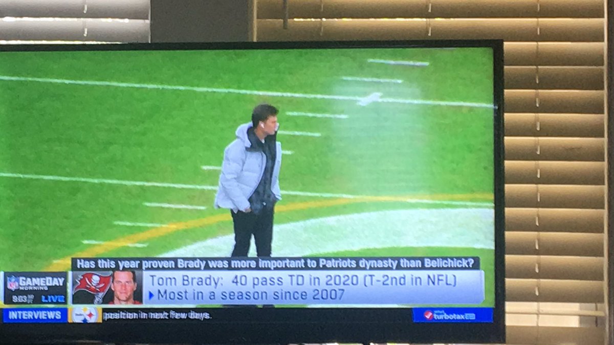 Brady walking around Lambeau Field looking for his orange mocha frappacino.