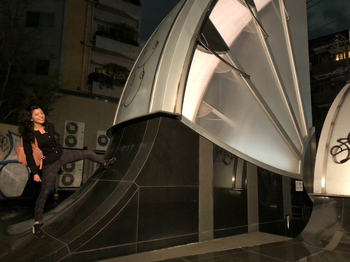 This is Earthtecture Sub-1 in Tokyo from 1991, where the whole office building is submerged underground, the only trace above being this strange garden of steel, glass & gtanite letting light downwards & letting ppl like my friend Alyssa in the second photo take silly-posed pics