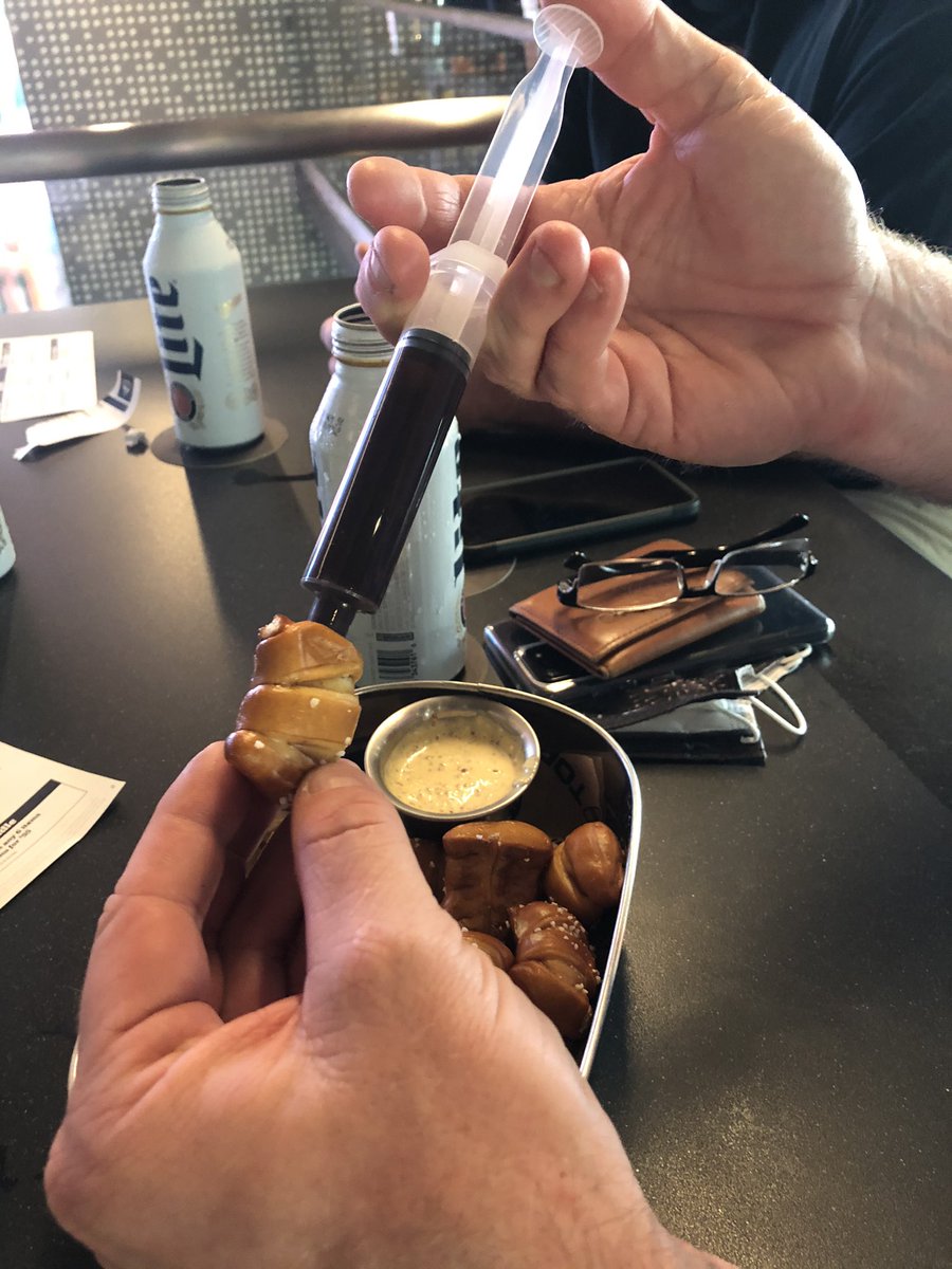 This is <a href="/CodeBlackIT/">CodeBlackIT</a> injecting chocolate syrup into a pretzel bite.  Side note, he has purple feet.