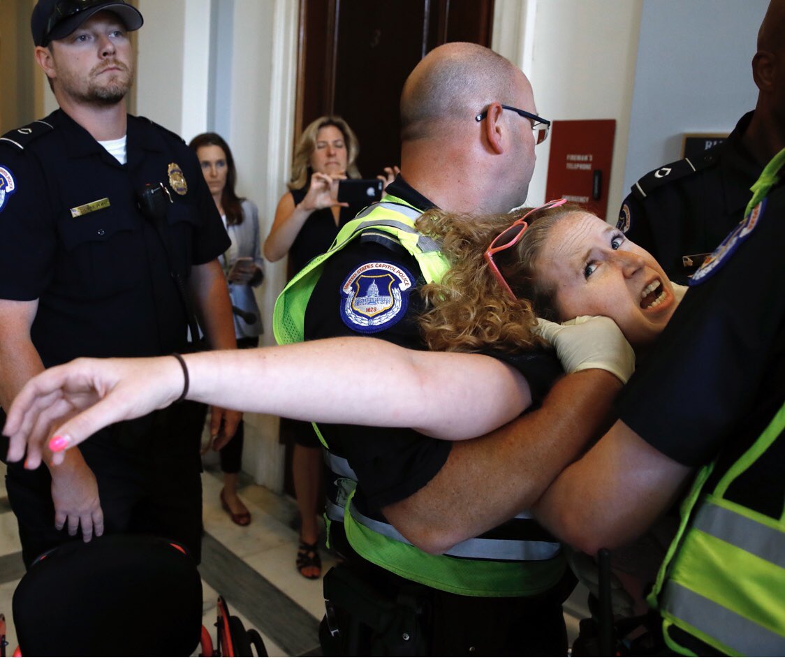 Amy_Siskind's tweet image. This is how disability advocates were treated when they peacefully protested to protect their healthcare outside of Mitch McConnell's office.  But we're gonna let the white supremacists who stormed the Capitol with intent to harm go free?