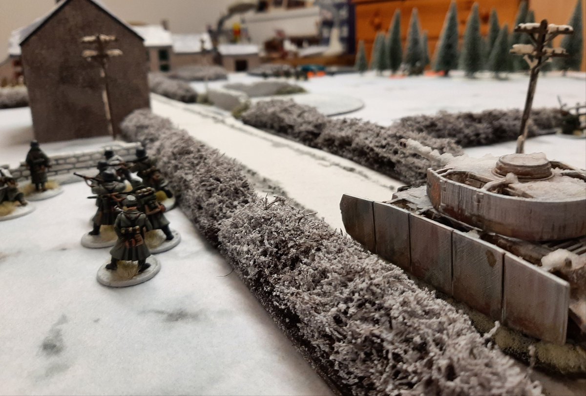 Pulling his troops back minus one squad that was pinned, the German cmdr tried to move up the left side of the table with the support of a Pz 4