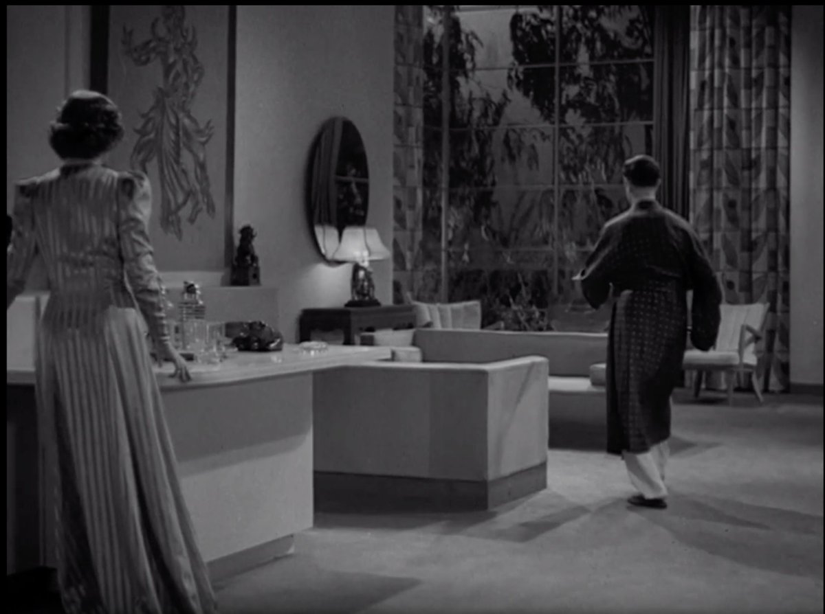 The reverse of the same room. Obviously, this was built on a stage but DEAR LORD the scale! The high ceilings! Those windows! Even the fish bowl is gigantic.