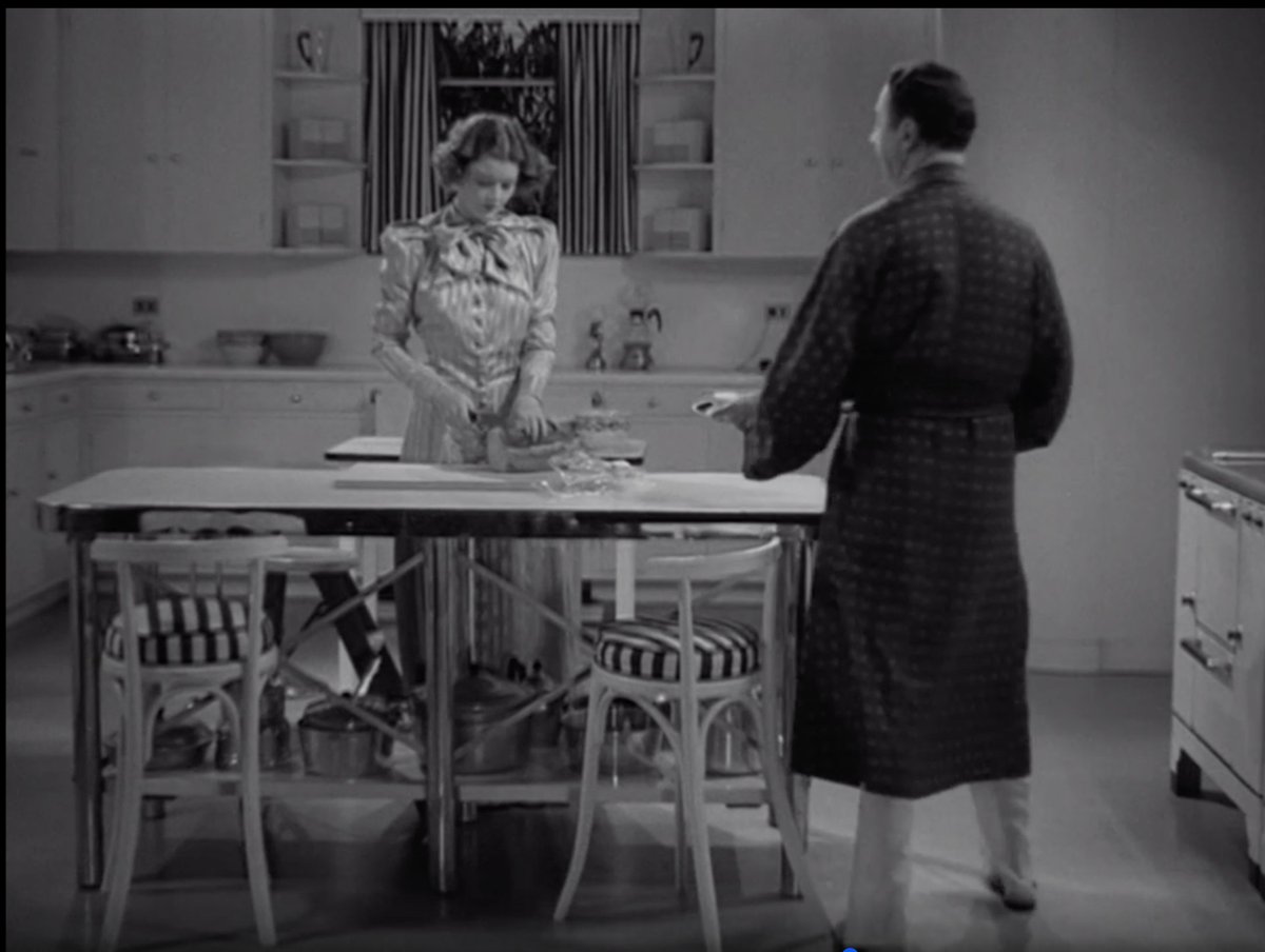 It's really rare to see a deco kitchen on film, so I always perk up whenever there's one on screen. I wish this was in color so bad - what do we think? Chiffon yellow? Robin's egg blue? Mint green? It has to be some kind of pastel. Love all of the chrome and then the fun stripes.