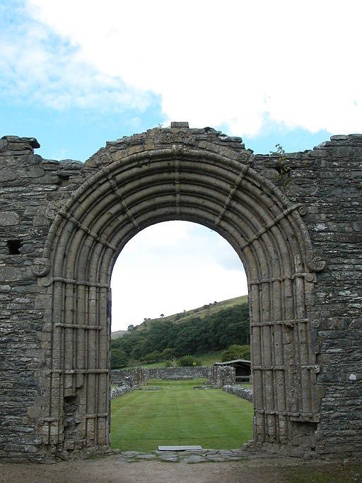 In the 14th century, Dafydd ap Gwilym, one of the greatest Welsh poets of all time (who’s buried at Strata Florida, Ceredigion), wrote a poem for St Dwynwen asking for help with his secret trysts with his married lover.  Strata Florida Abbey, William M. Connolley (CC)