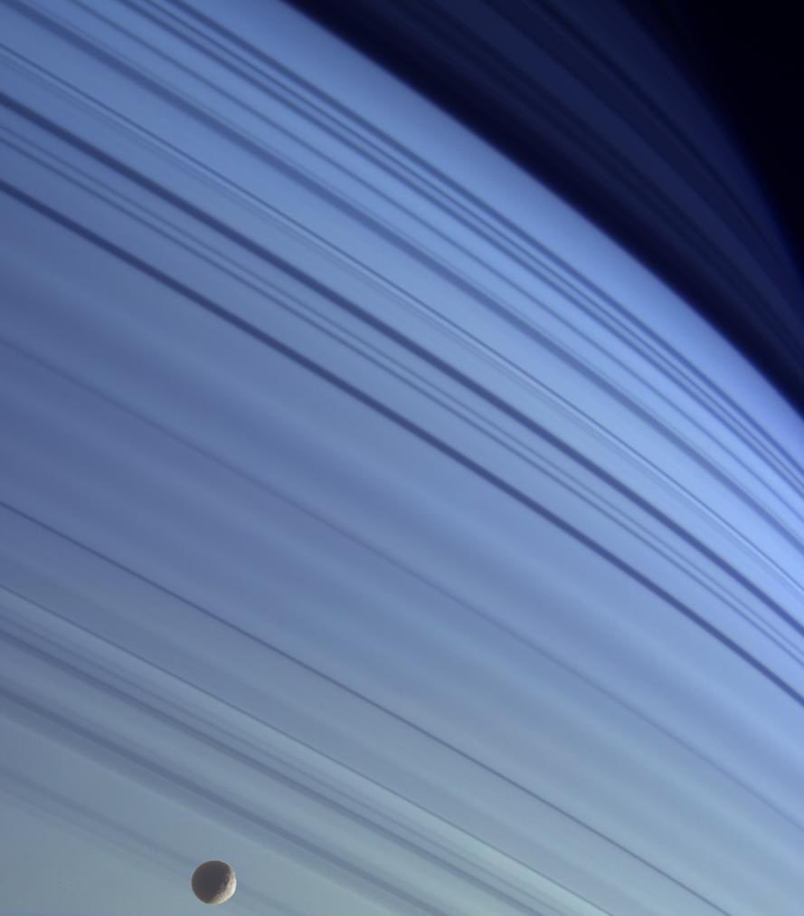 Beautiful true-color pic of Saturn’s rings + moon Mimas by <a href="/NASA/">NASA</a> Cassini spacecraft