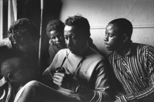 Parks (showing his camera to the family in 1968) wrote this powerful introduction to the story.“We are not so far apart as it might seem. There is something about both of us that goes deeper than blood or black and white. It is our common search for a better life, a better...”