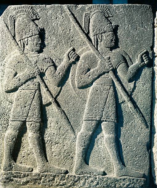 Turchia8's tweet photo. CIRCA 1900: Hittite civilization, 9th century b.C. Basalt slab with relief depicting warriors armed with spear and shield. From Carchemish, Turkey. Photo © DEA / M. SEEMULLER/De Agostini https://t.co/S33prGkYXP