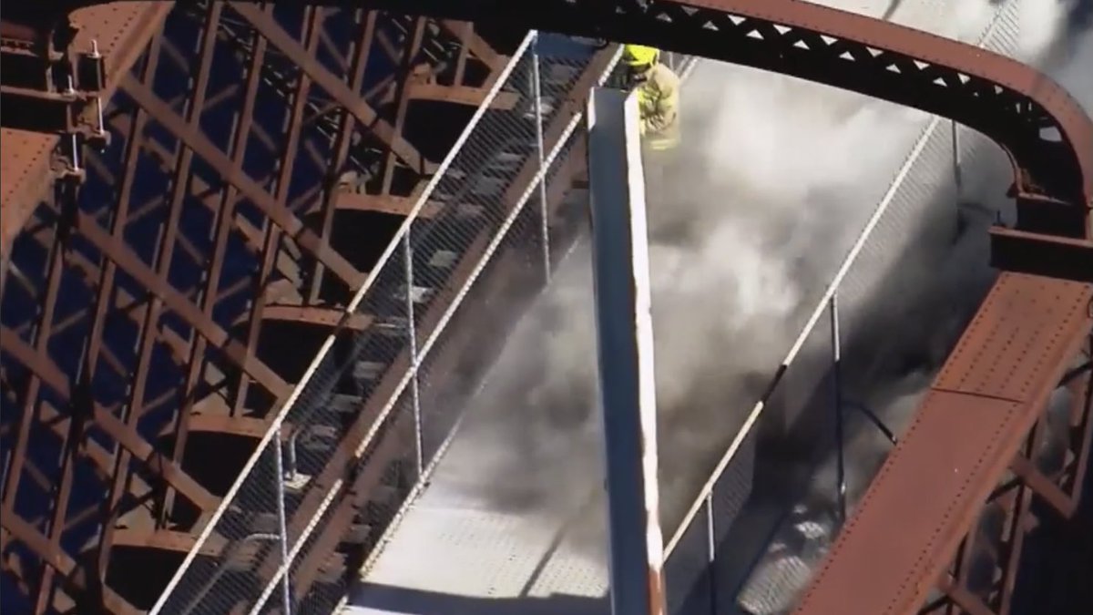 SydneyAlert's tweet photo. #BREAKING: A fire is burning on the Ryde Railway bridge at Rhodes this afternoon, trains have not been disturbed. More to come. #SydneyAlert https://t.co/Bm02MLhSl6