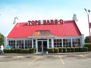 Tops is probably the most well known BBQ spot in the city. They have their own sauce that people either hate or love. Aint no in between. I suggest getting sauce on the side. You can also ask for all white meat too. The burgers though? That's what most people will tell you about.