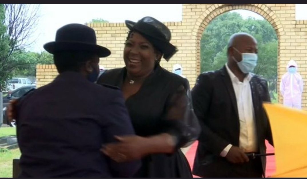 EricanSA's tweet photo. Four wrong things in one pic:

1) Not wearing a mask
2) No social distancing
3) hugging
4) hugging a person wearing a police uniform. 

#WearAMask #ArrestRefilweMtsweni https://t.co/fJQyRMwTqQ