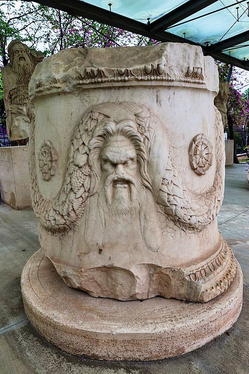 7/12 The base takes its inspiration from circular Roman altars like this one from the Theater of Dionysus, on the north slope of the Acropolis. With flowing garlands and intricate moulding, the only thing that’s missing is this great theater mask!