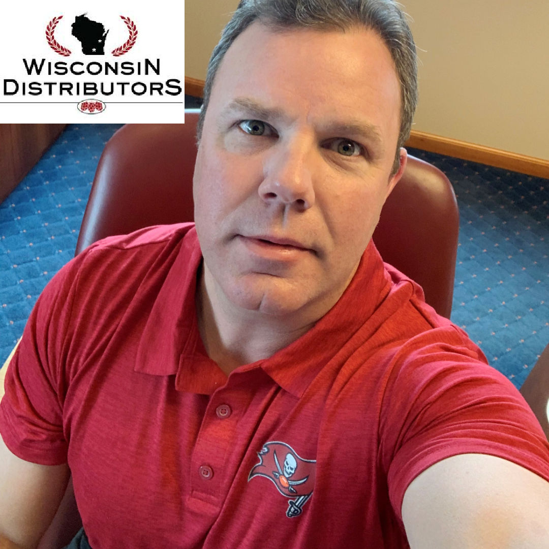 GreatBayDist's tweet photo. A bet is a bet!  
Wisconsin Distributors, Inc.'s president Casey Trudgeon sporting his Bucs gear in the heart of Packer's land this week.  Go Bucs! Home Field Advantage!! #Bucs #BucsVsPackers #BucsWin #SuperBowlLV #WisconsinDistributors #GreatBayDistributors #FriendlyWager https://t.co/GJHMDvXZ9I