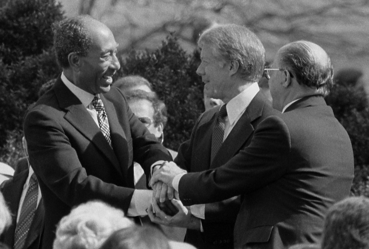 March 26, 1979: Peace Treaty between Egypt and Israel is signed. Here’s President Carter with Egyptian President Anwar Sadat, and Israeli Prime Minister Menachem Begin. A diplomatic BFD.