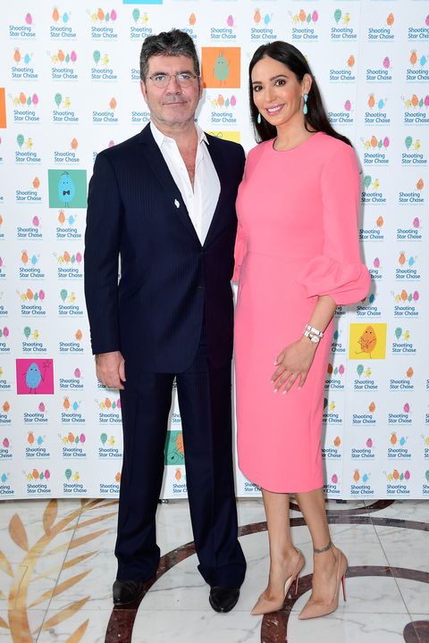 If that theory is true his beard is Lauren Silverman. They supposedly had a secret relationship (when she was married) but went public when she got pregnant in 2013. Her husband divorced her and made Simon stay away for his and Lauren's son or he would have to pay 50.000$ penalty