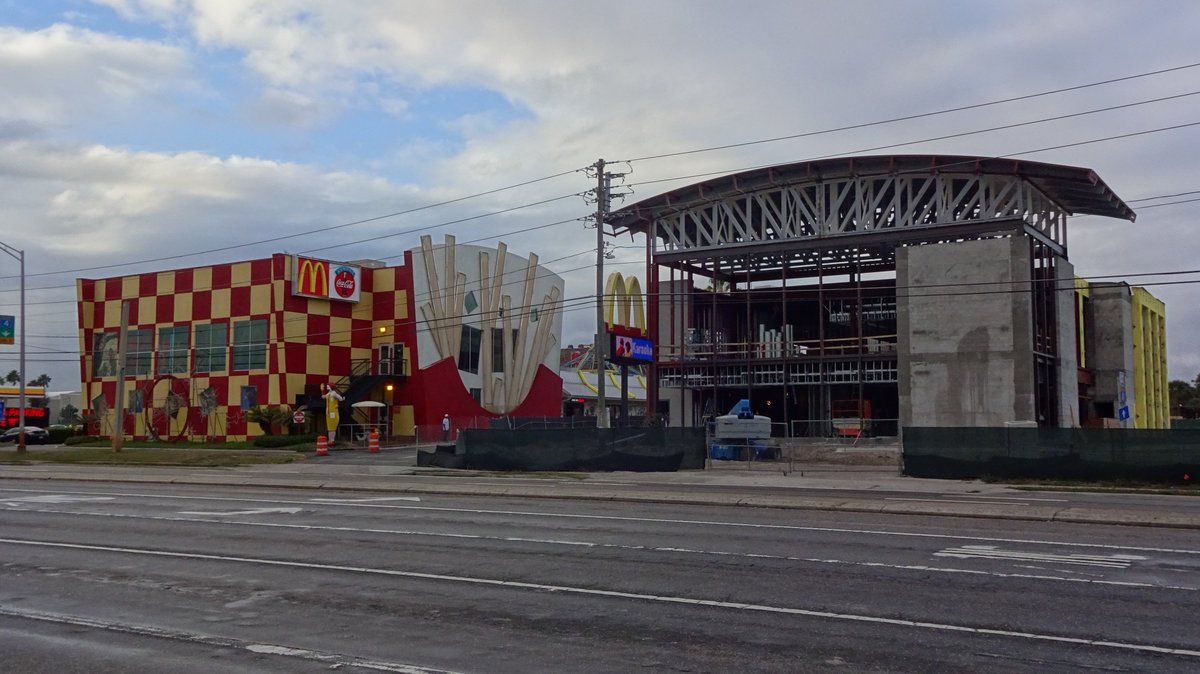 in 2015, a structure began to rise alongside the original location, being built to house its replacement. it wouldn't be until 2016 until the new mcdonald's finally opened; in its final days, the grand neon fries of the old location went dark.(photo credit:  @bioreconstruct)