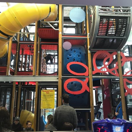 finally, the playplace - filled with more modern playground equipment, and an on-brand mcdonald's color scheme.