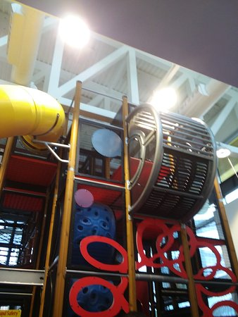 finally, the playplace - filled with more modern playground equipment, and an on-brand mcdonald's color scheme.