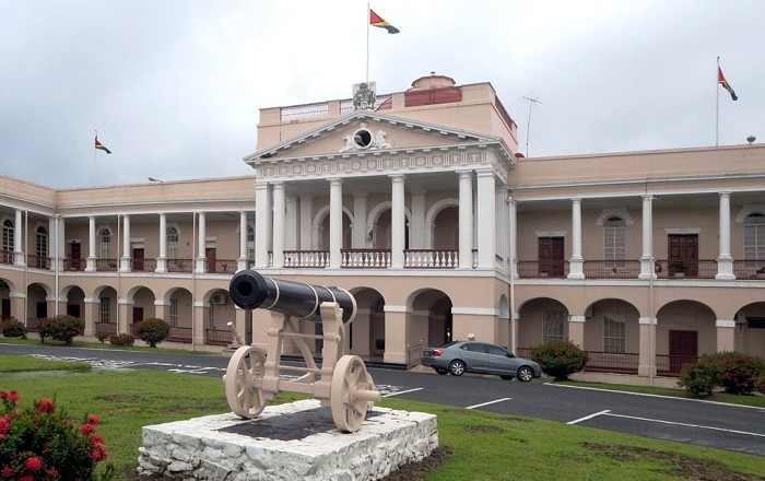 This evening we're headed to the Parliament Building in Georgetown, Guyana. The building was started in 1829 and was completed in 1843. It's an example of Renaissance architecture and is one of only two domed buildings in Georgetown. The statue below is of......