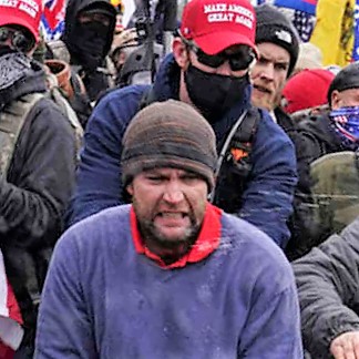  #RedPoloRising aka  #FBI56AFO  #56AFO Hi-res photo trying to snatch a barricade and getting a face full of pepper spray. Source:  https://www.wowkeren.com/berita/tampil/00346652.html  @capitolhunters  @SeditionHunters  @phoenixonwheels