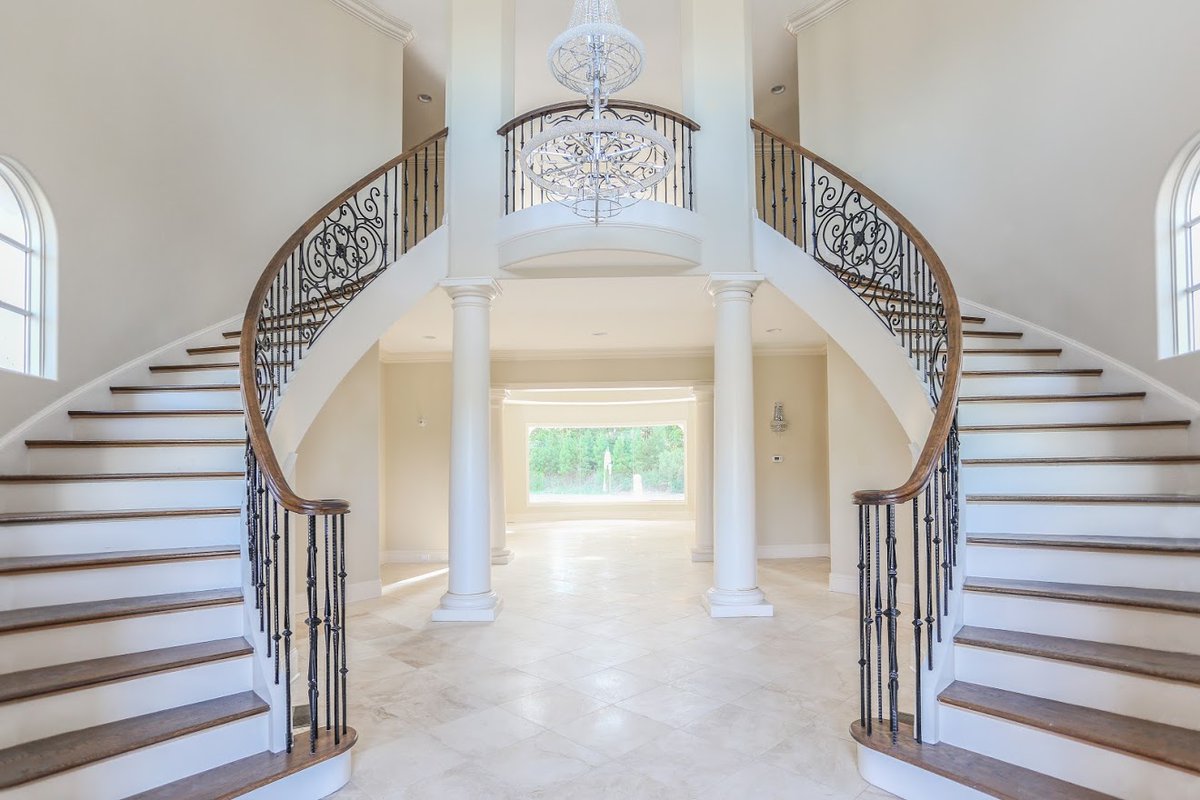 Would you love to come home to this Mediterranean style, dual-staircase grand entryway? This is just one of the many stunning features in Bold Construction's Mediterranean Masterpiece custom home! Click the link to see more photos of this custom home: buildboldnc.com/mediterranean-…