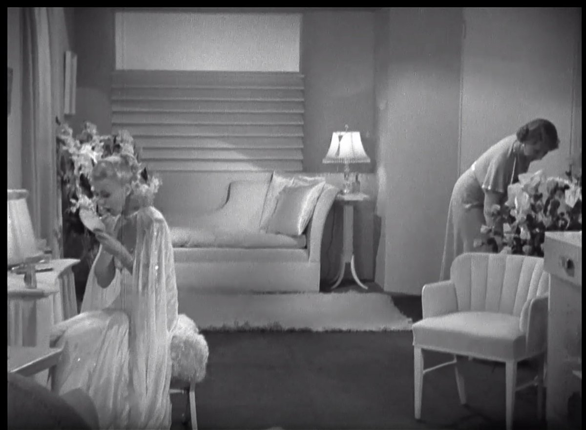 So many of the Fred & Ginger films are set against high end hotels or exotic locales, so the sets express that jet-setting attitude. Let's talk about the wall detail above the setee & that little velvet shell chair.