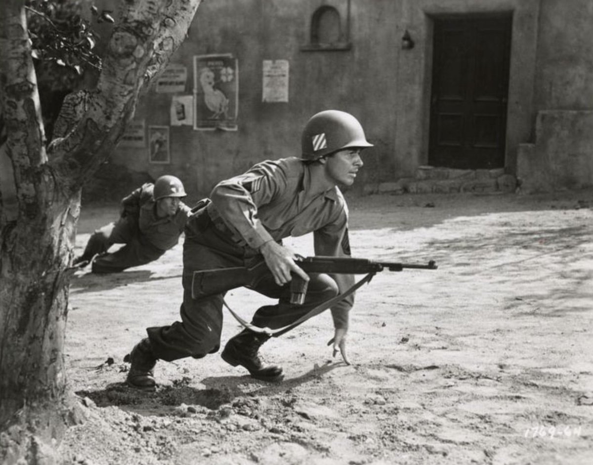 [5 of 13]Holtzwihr, France: Audie's platoon is overrun by six German tanks and wave after wave of German foot Soldier. He directs his men to fall back to cover but does not retreat with them. Instead, he holds his position to cover his men's move.[pic is from To Hell & Back]