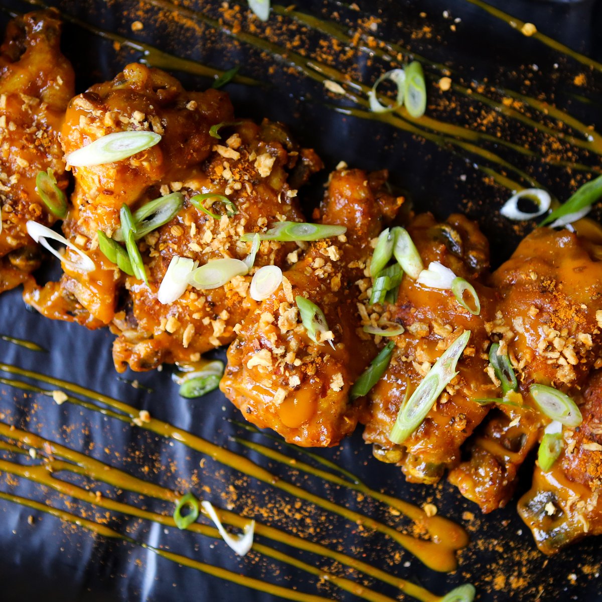 🚨 NEW MENU ITEM ALERT🚨

Meet our new Vindaloo Wings! We're talking nine jumbo, fall-off-the-bone chicken wings tossed in our Vindaloo sauce and seasoning, then topped with fried garlic and scallions. It's a shareable starter, but we get it if you want 'em all for yourself.